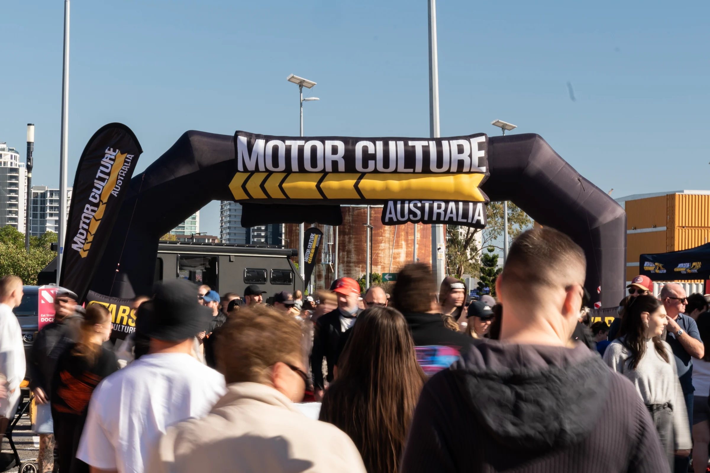 Crowds entering an MCA Cars & Culture event under the Motor Culture arch