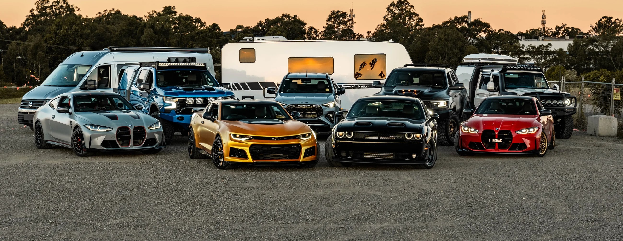 MCA prize car fleet lined up at dusk